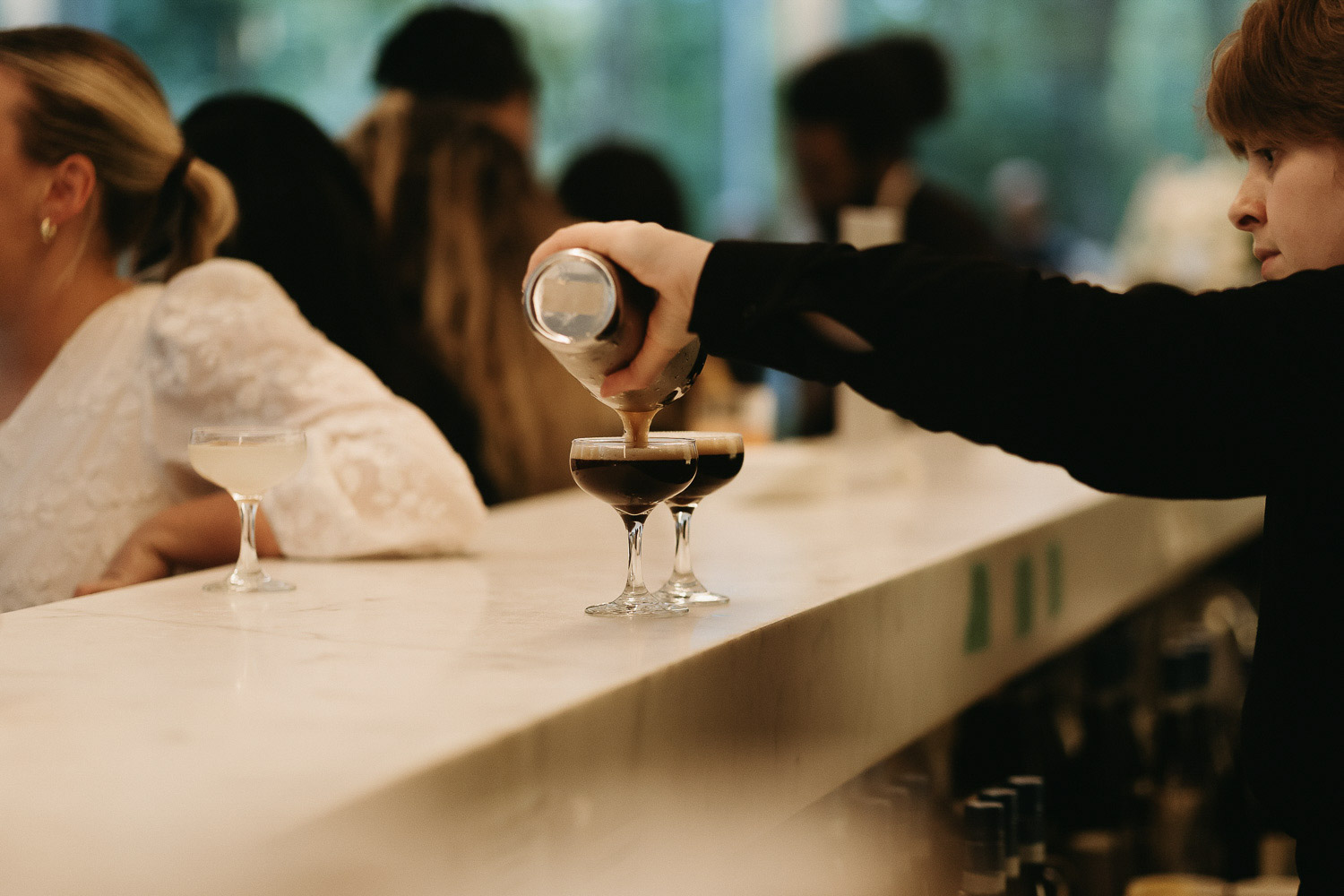 two espresso martini's being poured by bartender. Royal Conservatory of Music
