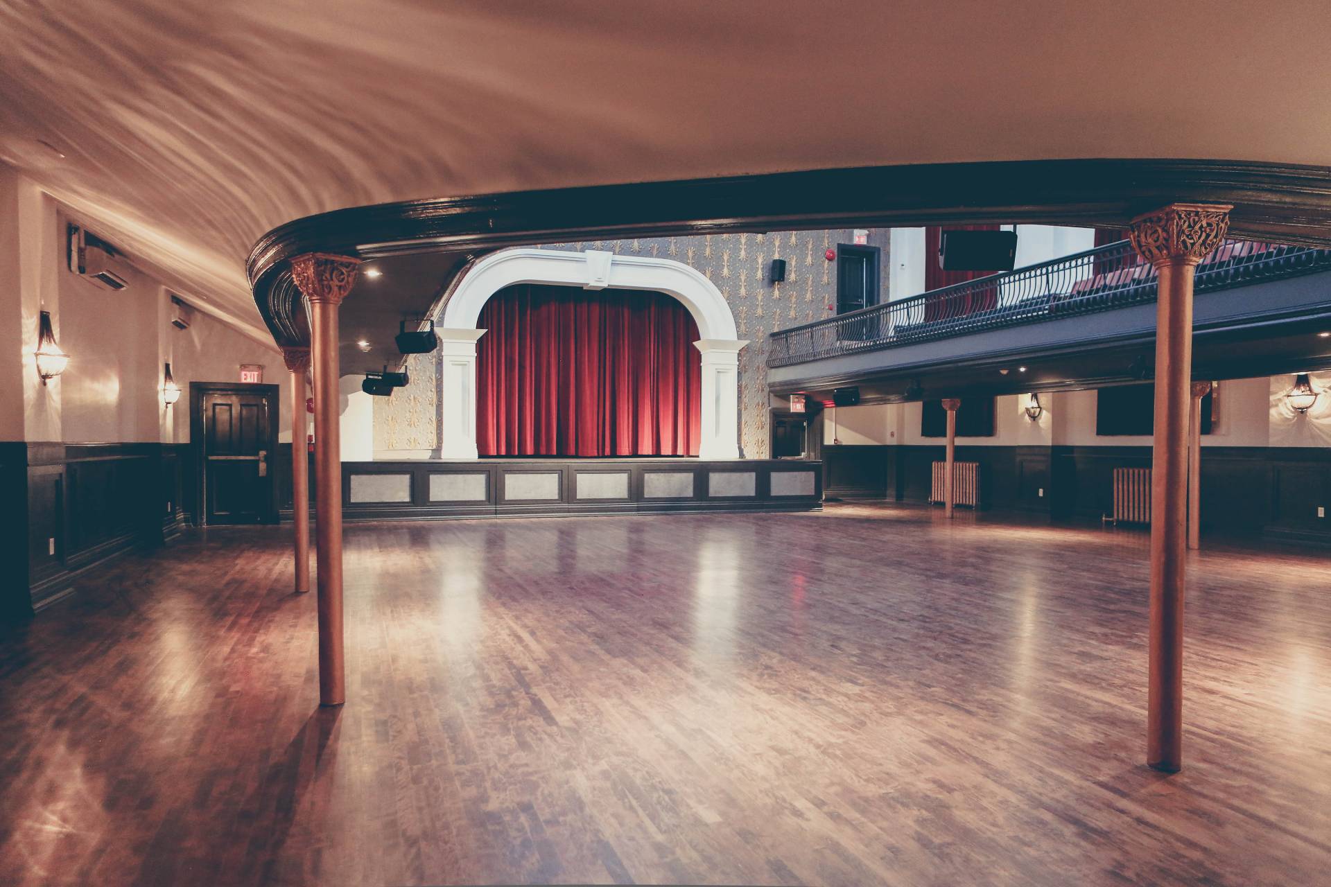 Theatre style room with red curtain in the front