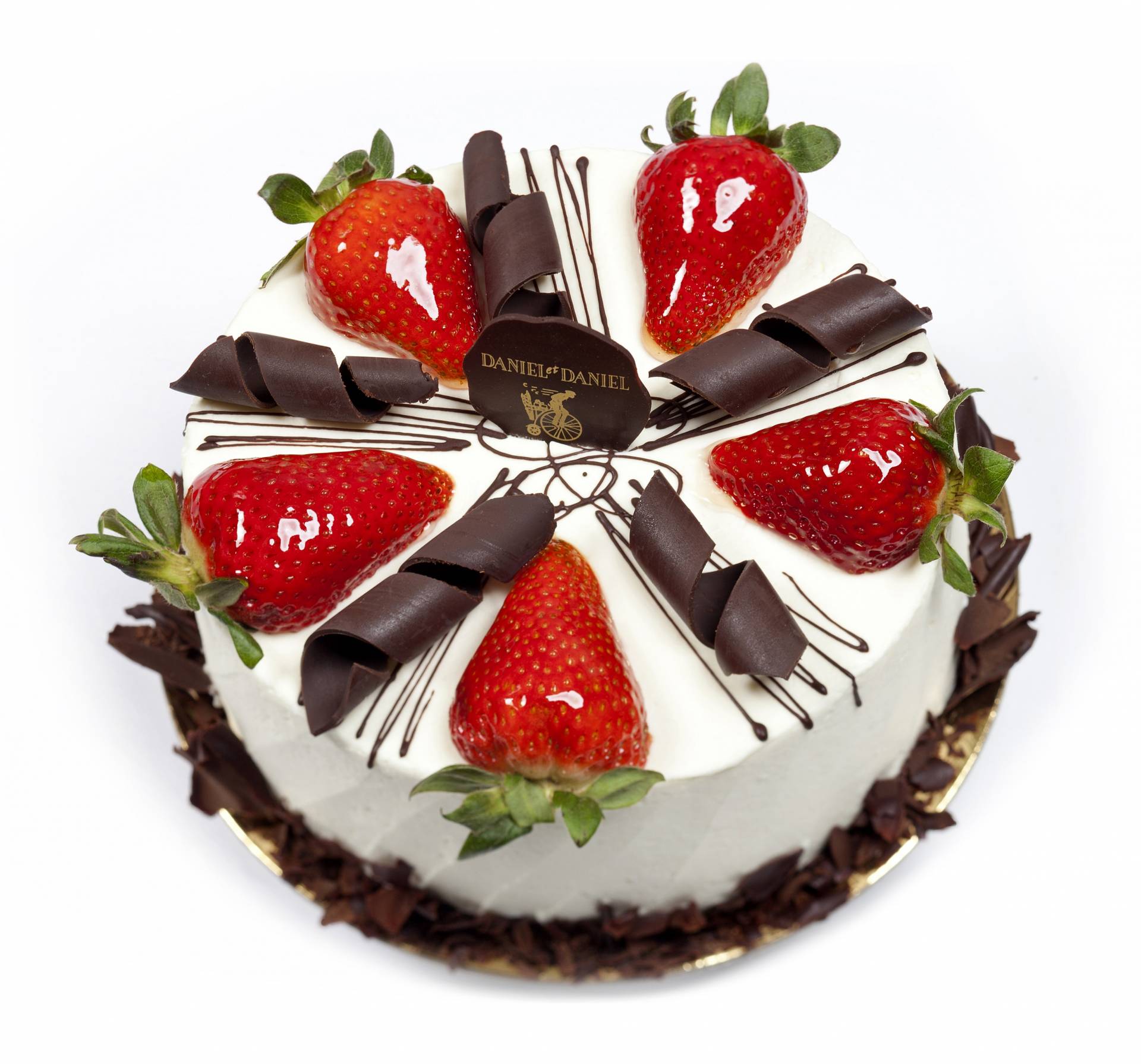 strawberry shortcake with fresh strawberries and chocolate swirls on top
