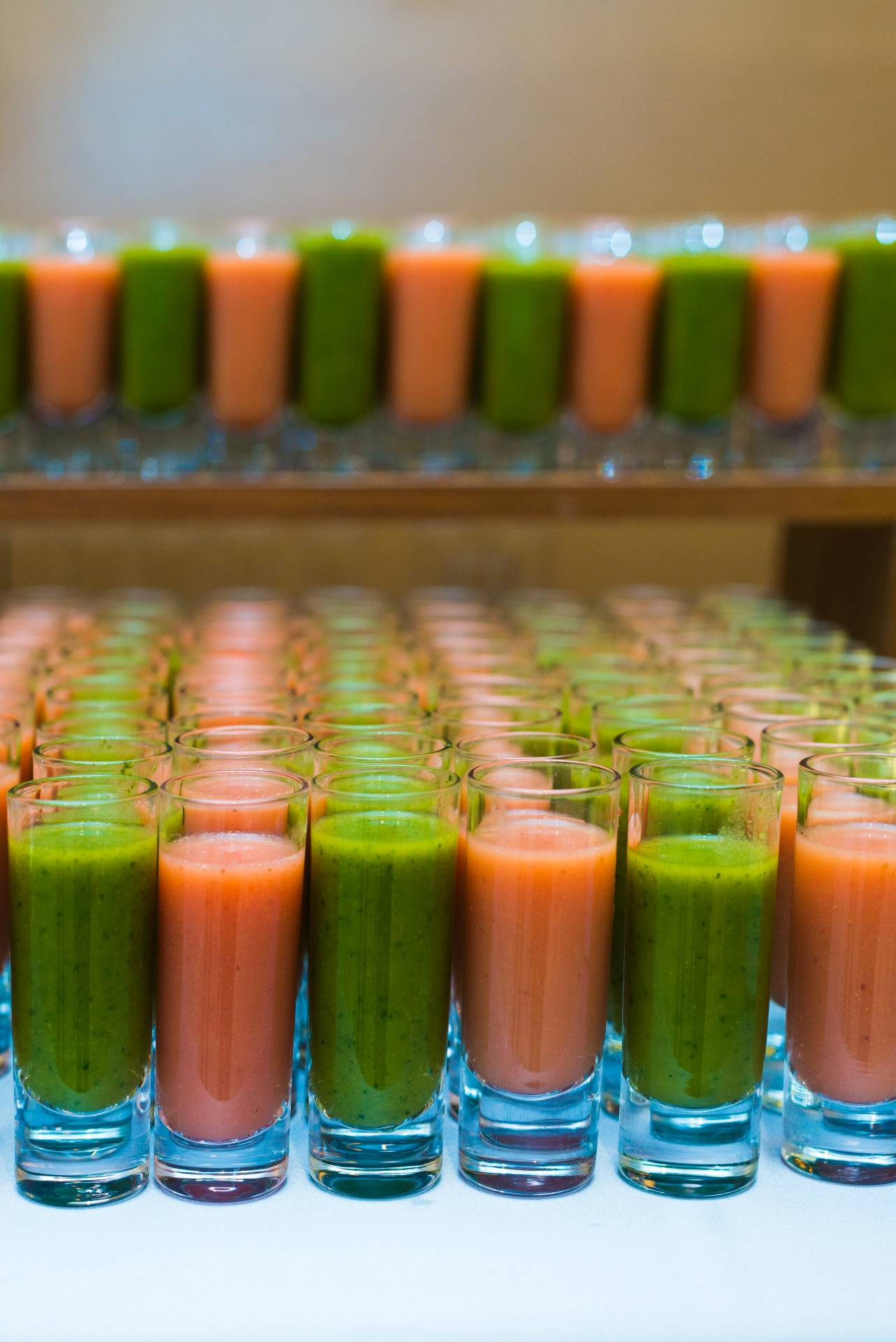 Multiple 4oz glasses of fresh pressed juices.