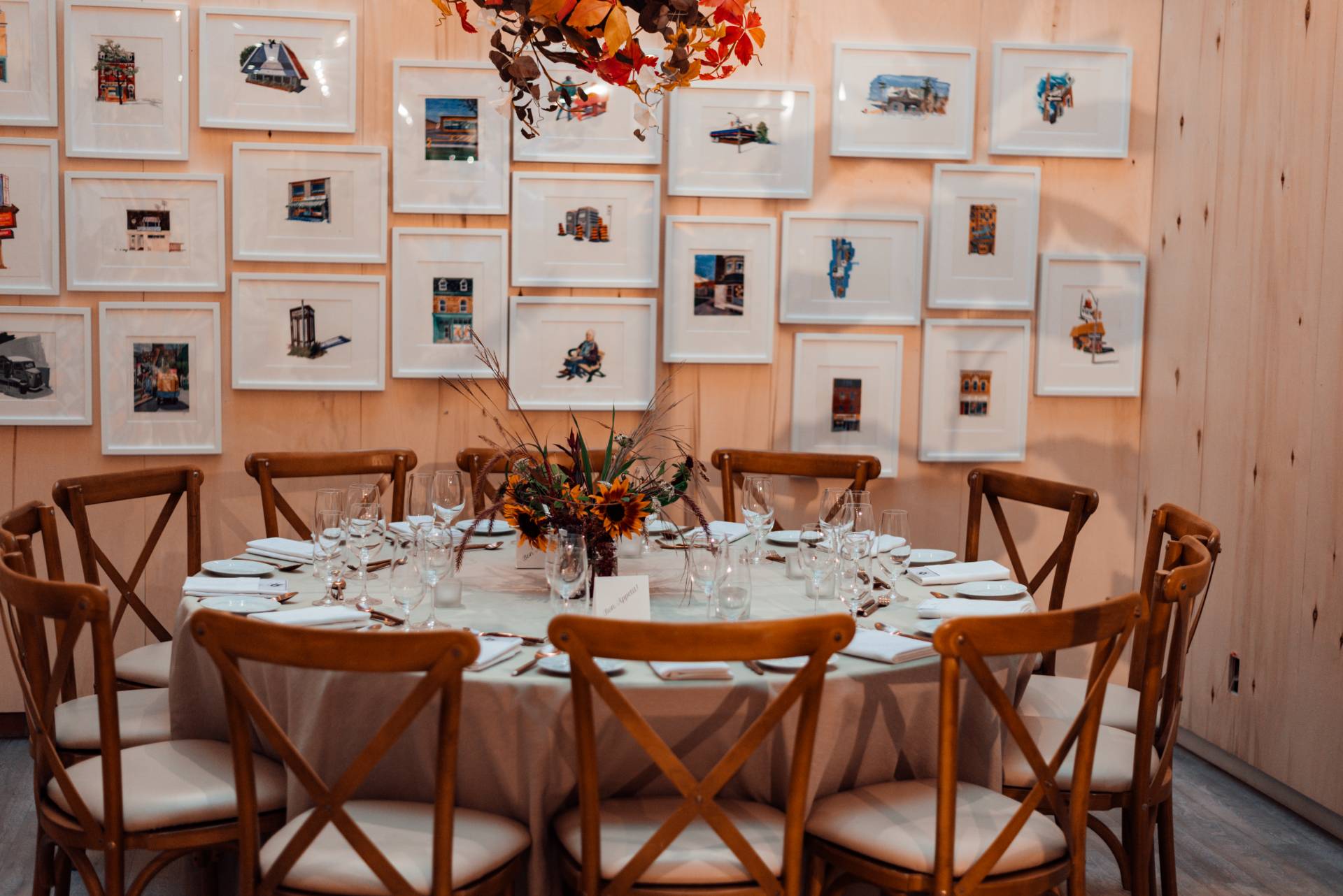 Classic wooden chairs around a round table.